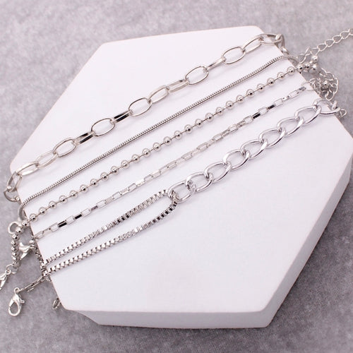 LAYERED BRACELET SET.