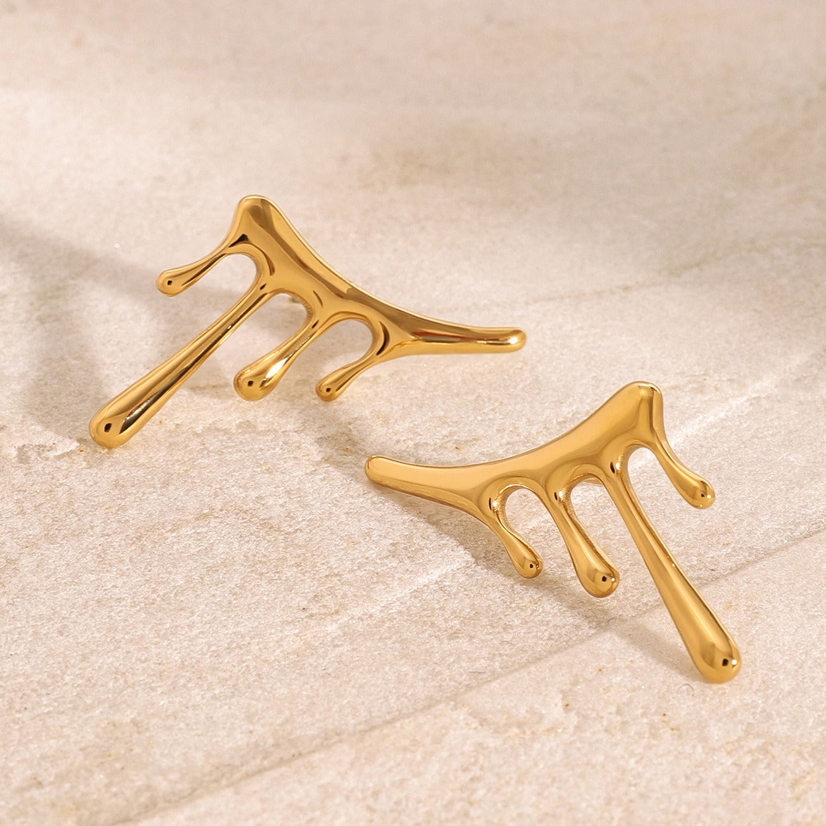 18K gold handcrafted drop earrings on ear, movement and light catch — MINIMAL
