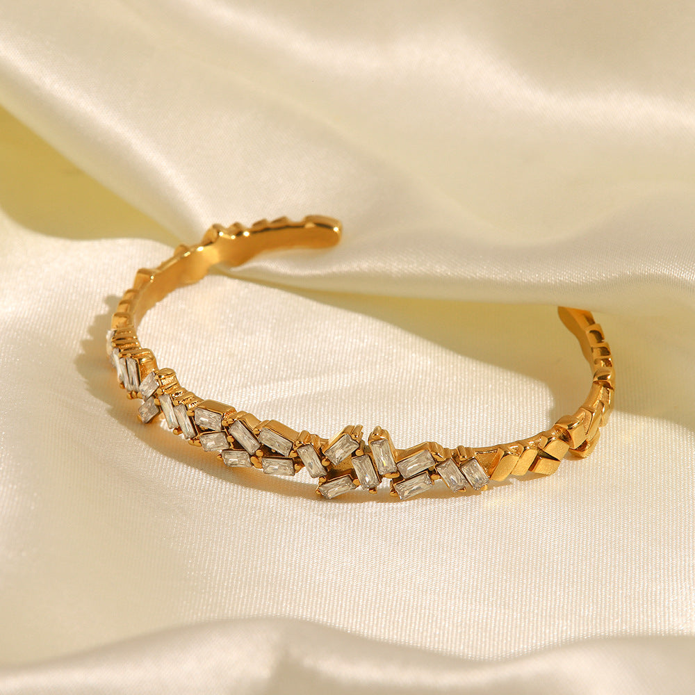 18K gold zircon open cuff bracelet flat lay, geometric silhouette — MINIMAL
