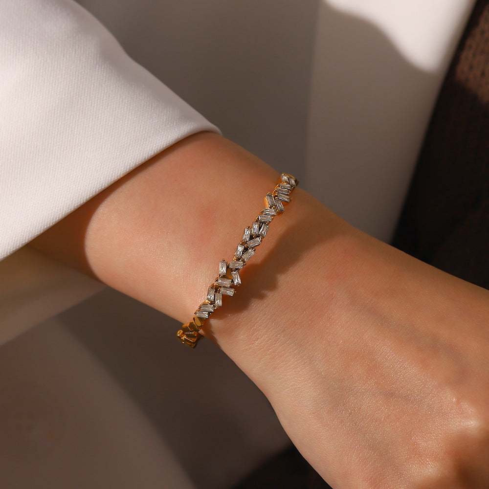 18K gold open cuff bracelet on wrist, exquisite zircon inlay detail — MINIMAL