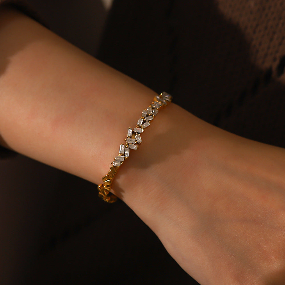 Close-up of zircon stone inlay on 18K gold open cuff bracelet — MINIMAL
