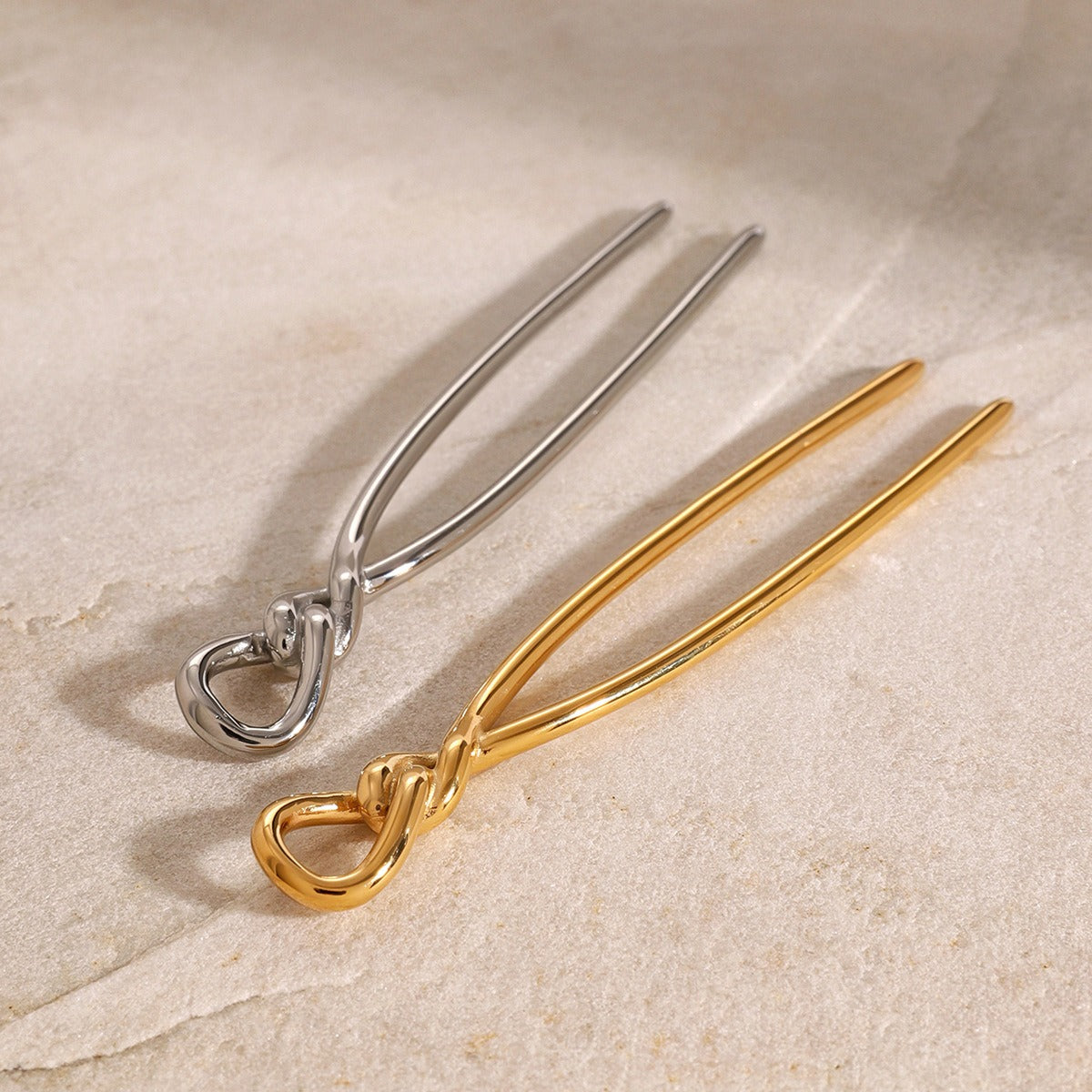 18K gold geometric knot hair pin detail view, titanium steel with PVD plating, MINIMAL