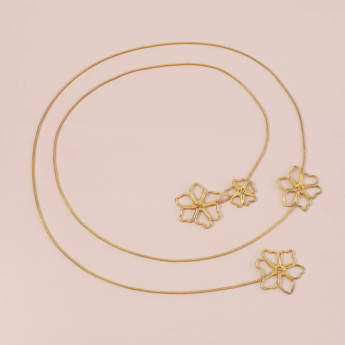 Alt text: 18K gold flower pendant necklace, floral design on long 65cm chain, gold-plated alloy, MINIMAL