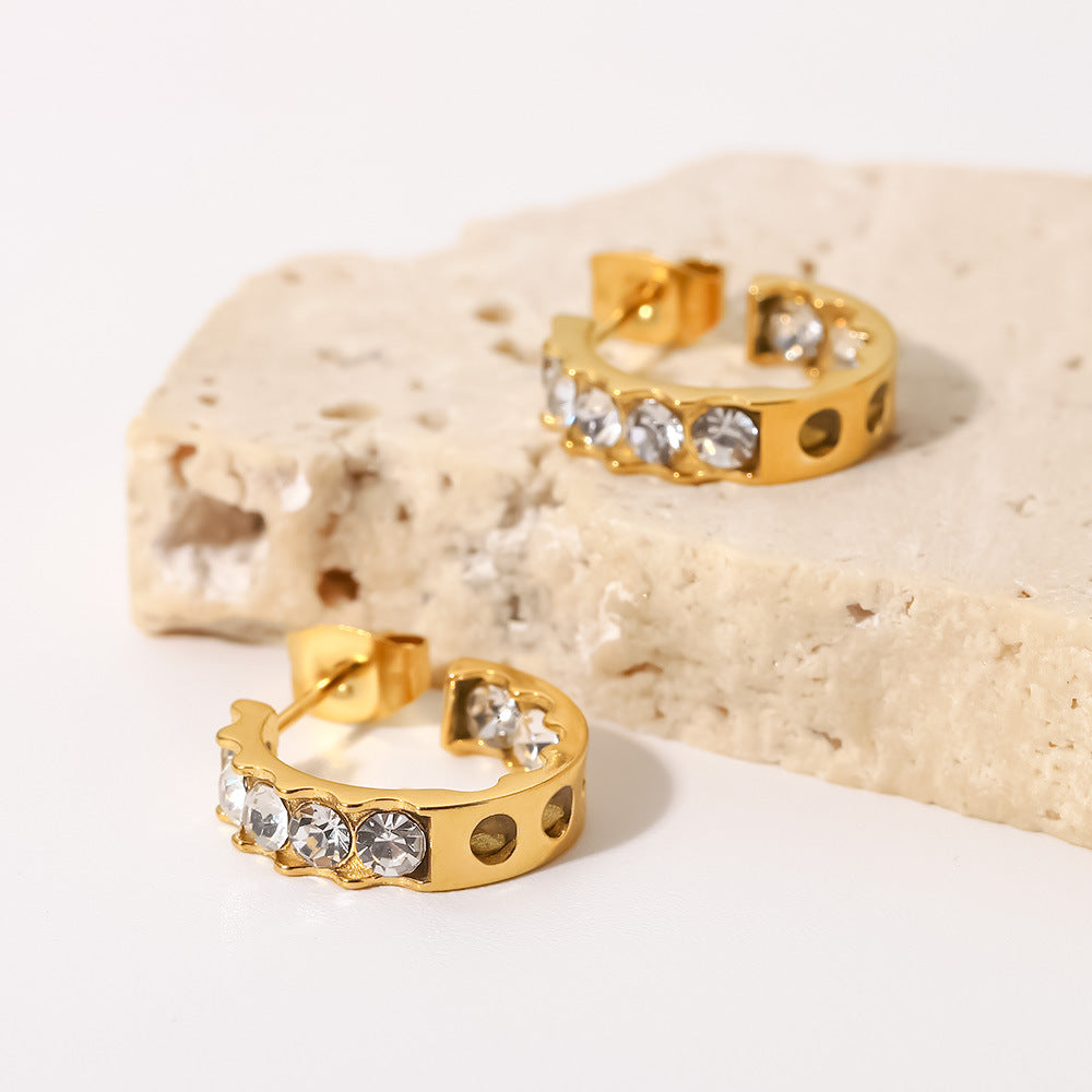 18K gold zircon dangle earrings on ear, bright stone catch of light — MINIMAL