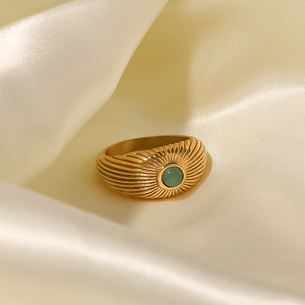 18K gold sun-shaped ring with natural green stone center, radiating silhouette, titanium steel with PVD gold plating, MINIMAL