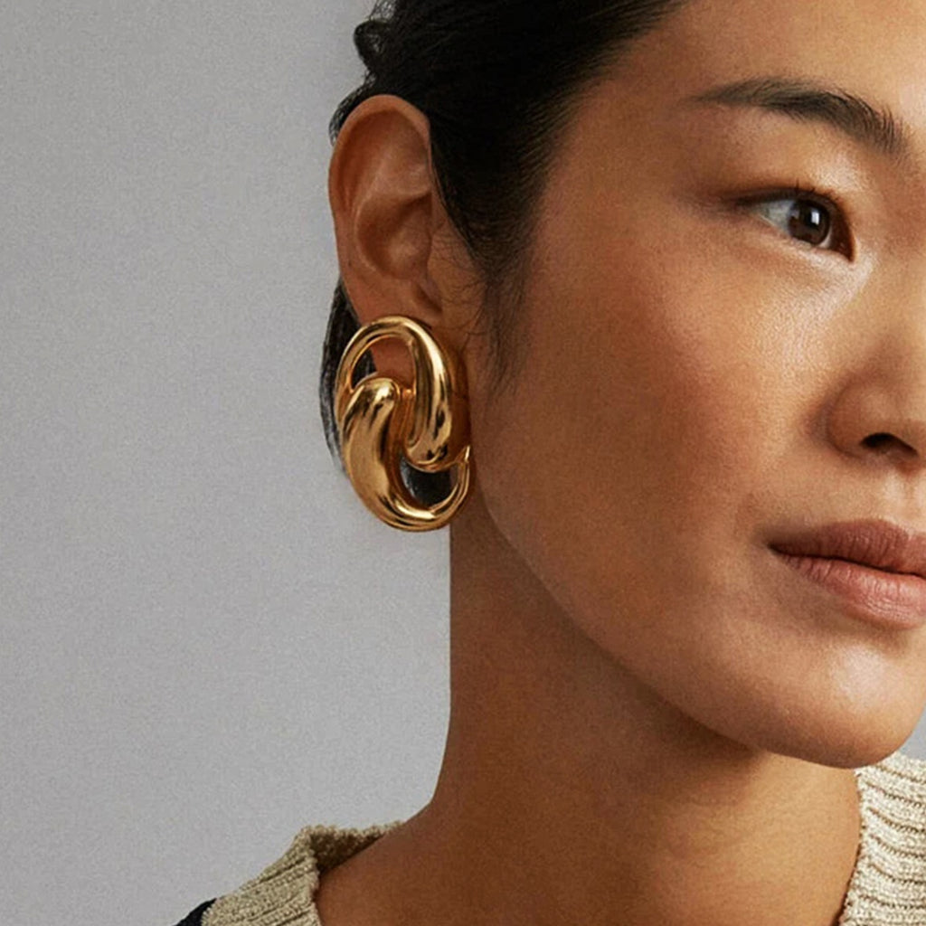 18K gold double teardrop hollow earrings in titanium steel — sculptural fine jewelry — MINIMAL