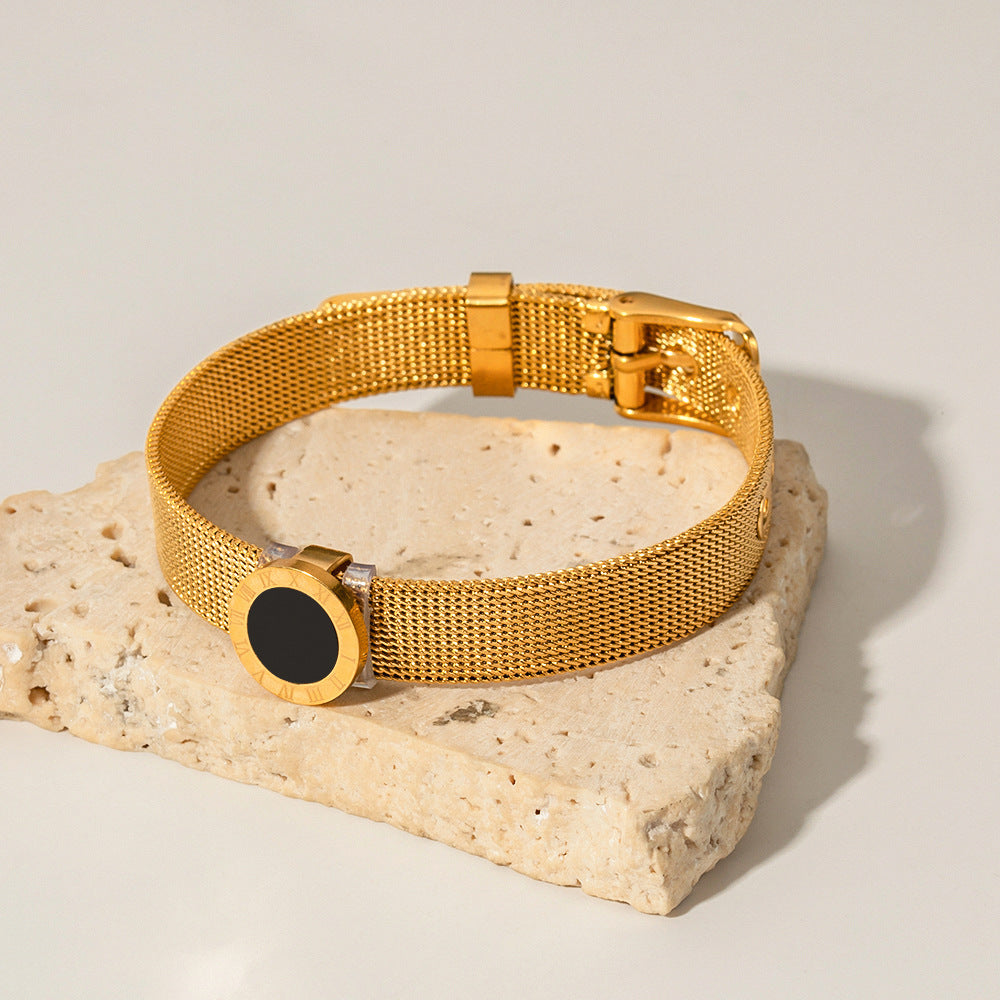  18K gold Roman numeral black gemstone bracelet flat lay, watch-band silhouette — MINIMAL